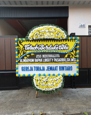 Papan Bunga Duka di Paal Dua